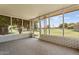 Enclosed sunroom with screened windows and door offering views of the backyard at 10839 W Peoria Ave, Sun City, AZ 85351