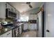 Well-appointed kitchen featuring granite countertops, stainless steel appliances, and bright white cabinets at 1117 W Manor St, Chandler, AZ 85224