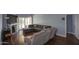 Bright living room with hardwood floors, a fireplace, and access to the outdoor patio through sliding glass doors at 1117 W Manor St, Chandler, AZ 85224