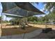 Community playground with modern equipment, sunshade, and accessible design for enjoyment at 1117 W Manor St, Chandler, AZ 85224