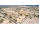 Rural living is on display in this aerial shot, featuring homes, roads, open spaces, and desert landscape, offering a quiet lifestyle at 11912 N Thunderbird Rd, Maricopa, AZ 85139