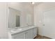 Bright bathroom features a double vanity sink and a large mirror for added convenience at 11912 N Thunderbird Rd, Maricopa, AZ 85139
