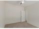 This carpeted bedroom features neutral walls at 11912 N Thunderbird Rd, Maricopa, AZ 85139