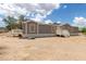 Charming single story home featuring neutral paint, contrasting trim and side deck at 11912 N Thunderbird Rd, Maricopa, AZ 85139