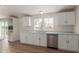 Bright kitchen featuring stainless dishwasher and views to backyard at 11912 N Thunderbird Rd, Maricopa, AZ 85139