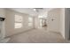 Open-concept living room with light-colored walls and new carpeting at 11912 N Thunderbird Rd, Maricopa, AZ 85139