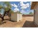 This white shed offers extra storage space for gardening equipment, tools, or outdoor furniture at 11912 N Thunderbird Rd, Maricopa, AZ 85139