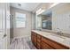 Bathroom boasts a double vanity, large mirror, and glass-enclosed shower at 1344 N Claiborne --, Mesa, AZ 85205