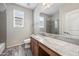 Bathroom featuring wood-look tile flooring, a vanity, and a large mirror above the sink at 1344 N Claiborne --, Mesa, AZ 85205