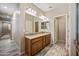 Bathroom featuring double sinks, and light wood-look floors at 1344 N Claiborne --, Mesa, AZ 85205