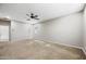 Bright bedroom with plush carpet, ceiling fan, and ample natural light at 1344 N Claiborne --, Mesa, AZ 85205
