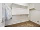 Walk-in closet with custom shelving offers ample storage solutions at 1344 N Claiborne --, Mesa, AZ 85205