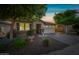 Attractive home with a two-car garage and manicured front yard with desert landscaping at 1344 N Claiborne --, Mesa, AZ 85205