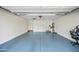 Garage with a coated floor, storage cabinets, and access to utilities such as a water heater at 1344 N Claiborne --, Mesa, AZ 85205