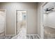 Hallway with wood-look floors leading to bedrooms at 1344 N Claiborne --, Mesa, AZ 85205