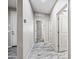 Hallway with wood-look tile flooring that provides access to other rooms of the home at 1344 N Claiborne --, Mesa, AZ 85205