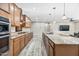 Modern kitchen with stainless steel appliances, granite countertops, wood cabinets, and open layout for entertaining at 1344 N Claiborne --, Mesa, AZ 85205