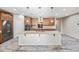 Spacious kitchen island with marble countertops, stainless steel appliances, and sleek wood cabinetry at 1344 N Claiborne --, Mesa, AZ 85205