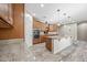 Modern kitchen showcasing stainless steel appliances, granite countertops, and ample wood cabinet storage at 1344 N Claiborne --, Mesa, AZ 85205