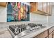 Modern kitchen features stainless steel gas range with granite countertops and custom backsplash at 1344 N Claiborne --, Mesa, AZ 85205