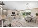Virtually staged living and dining areas with hardwood floors and plenty of natural light at 1344 N Claiborne --, Mesa, AZ 85205