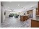Spacious open-concept living area with a large kitchen island, ideal for entertaining at 1344 N Claiborne --, Mesa, AZ 85205