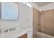 Practical bathroom with tiled shower, single sink vanity, and functional layout at 13913 N 2Nd Ave, El Mirage, AZ 85335