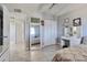 Spacious bedroom with tile floors, closet space, vanity, and neutral decor at 13913 N 2Nd Ave, El Mirage, AZ 85335