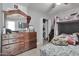 Bedroom with a wooden dresser, bunk bed, and tile flooring at 13913 N 2Nd Ave, El Mirage, AZ 85335