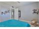 Bedroom with tile floors, ceiling fan, and simple yet stylish decor at 13913 N 2Nd Ave, El Mirage, AZ 85335