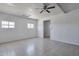 Bright bedroom with tile flooring and a ceiling fan for comfortable living at 13913 N 2Nd Ave, El Mirage, AZ 85335