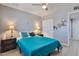 Comfortable bedroom with tile flooring, ceiling fan, and coordinated furnishings at 13913 N 2Nd Ave, El Mirage, AZ 85335