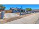 The exterior showcasing the driveway, fence and landscaped yard of the property at 13913 N 2Nd Ave, El Mirage, AZ 85335
