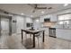 Well-lit kitchen featuring white cabinets and stainless steel appliances at 13913 N 2Nd Ave, El Mirage, AZ 85335