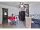 Kitchen with a red tablecloth, tile flooring, and a ceiling fan at 13913 N 2Nd Ave, El Mirage, AZ 85335