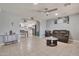 Open-concept living room with tile flooring and a view of the updated kitchen at 13913 N 2Nd Ave, El Mirage, AZ 85335