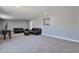 Large living room with neutral carpet and lots of space at 13913 N 2Nd Ave, El Mirage, AZ 85335