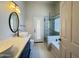 Updated bathroom featuring a double vanity, modern fixtures, and separate glass shower at 1463 E Silver Creek Rd, Gilbert, AZ 85296