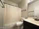 Cozy bathroom featuring a tub, toilet, vanity, and shower curtain at 1463 E Silver Creek Rd, Gilbert, AZ 85296