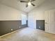 Cozy bedroom with neutral carpeting, a ceiling fan, and a closet for storage at 1463 E Silver Creek Rd, Gilbert, AZ 85296