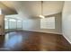 Spacious living room with hardwood floors, lots of natural light, and vaulted ceilings at 1463 E Silver Creek Rd, Gilbert, AZ 85296