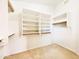 Spacious walk-in closet with custom shelving and ample storage, perfect for organization at 1463 E Silver Creek Rd, Gilbert, AZ 85296