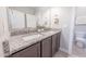 Well-appointed bathroom featuring dual sinks and granite countertop at 15248 S 182Nd Ln, Goodyear, AZ 85338