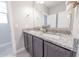 Elegant bathroom featuring dual sinks and granite countertop at 15248 S 182Nd Ln, Goodyear, AZ 85338