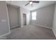 Bright bedroom with a window, plush carpet, and closet with a sliding door at 15248 S 182Nd Ln, Goodyear, AZ 85338