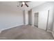 A spacious bedroom has carpet and closet with a sliding door at 15248 S 182Nd Ln, Goodyear, AZ 85338