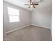 Light and airy bedroom with a bright window and ceiling fan at 15248 S 182Nd Ln, Goodyear, AZ 85338