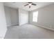 Comfortable bedroom featuring a ceiling fan and bright window at 15248 S 182Nd Ln, Goodyear, AZ 85338