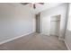 This bedroom has a window and closet with sliding door at 15248 S 182Nd Ln, Goodyear, AZ 85338