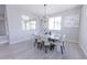 Bright dining room with natural light and stylish chandelier, perfect for Gathering gatherings at 15248 S 182Nd Ln, Goodyear, AZ 85338